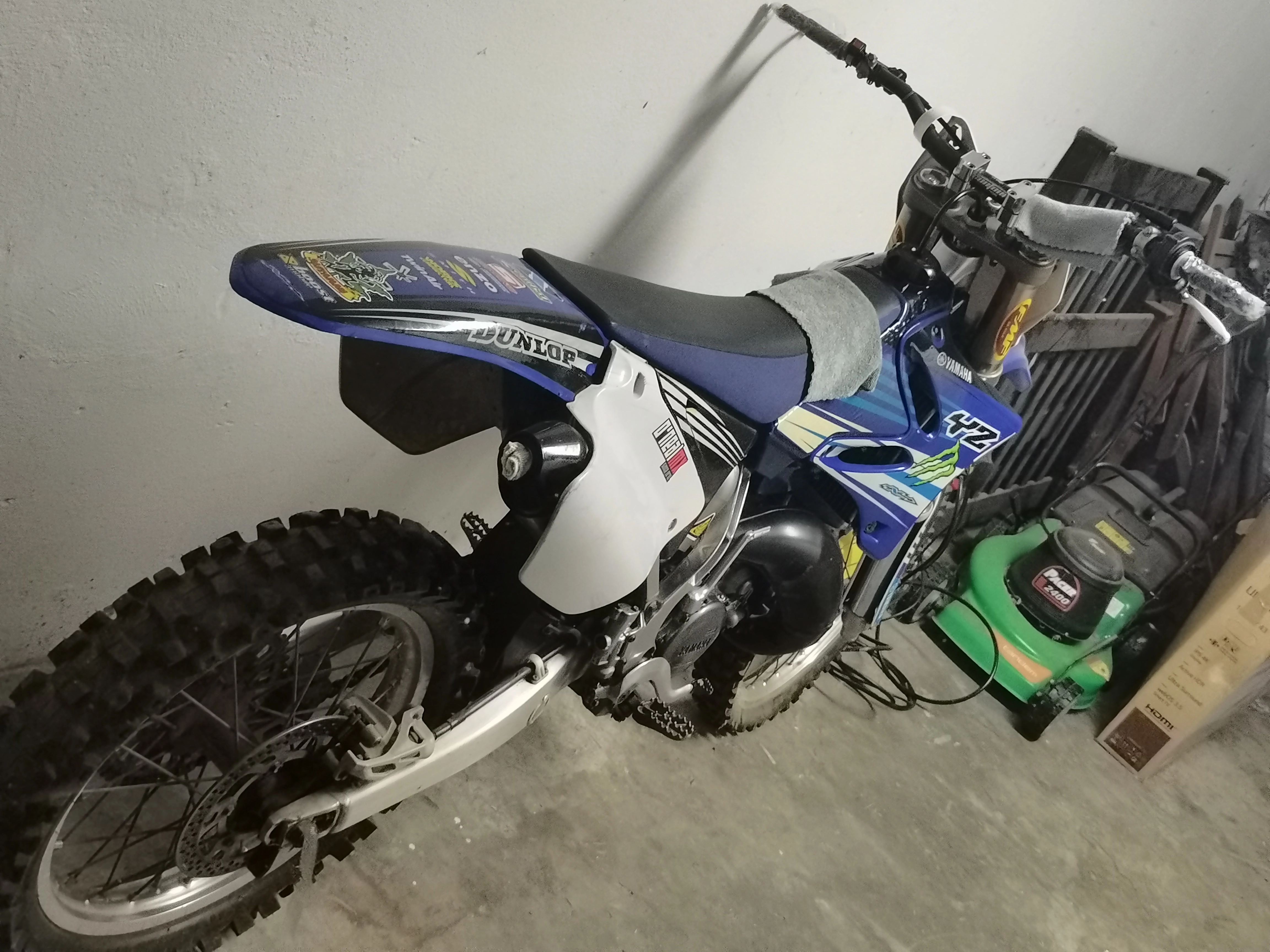 A Yamaha YZ125 dirt bike in storage