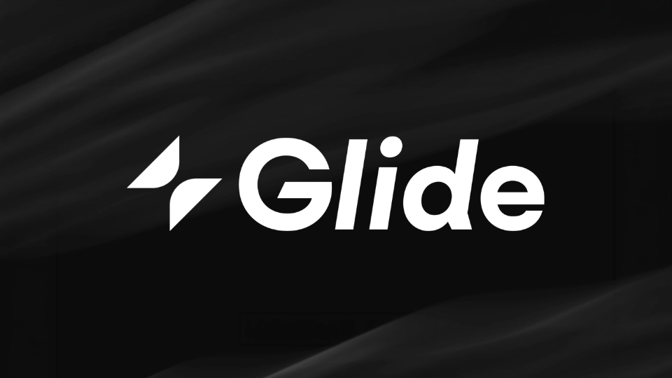Placeholder image for a Glide app builder view showing a data table, app screens, and action workflows